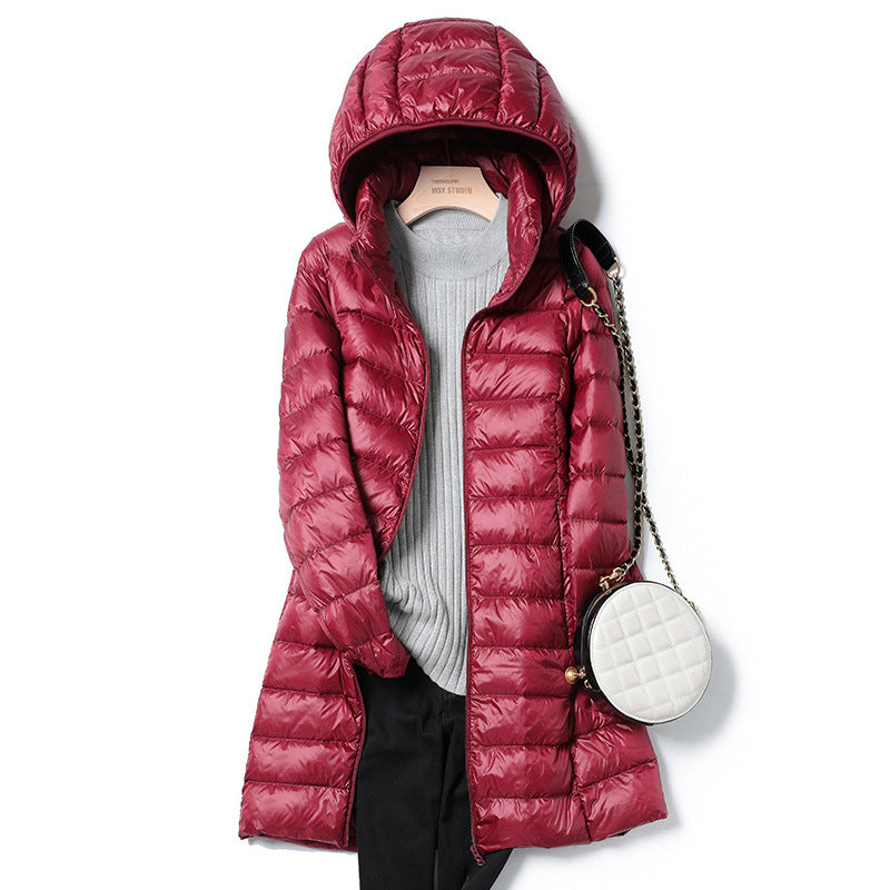 A mid-length, lightweight down jacket for women