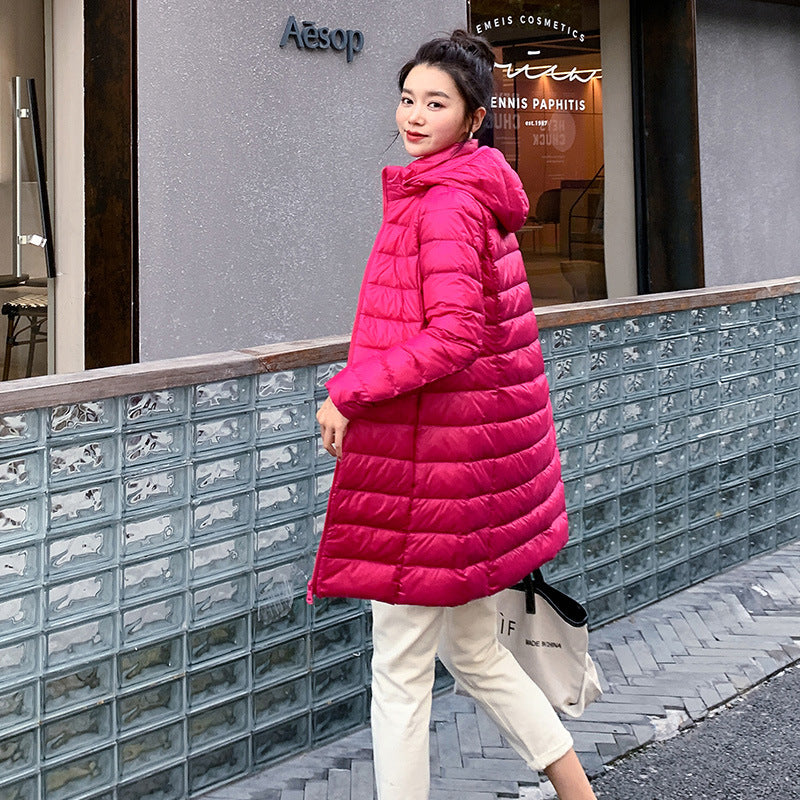 A mid-length, lightweight down jacket for women