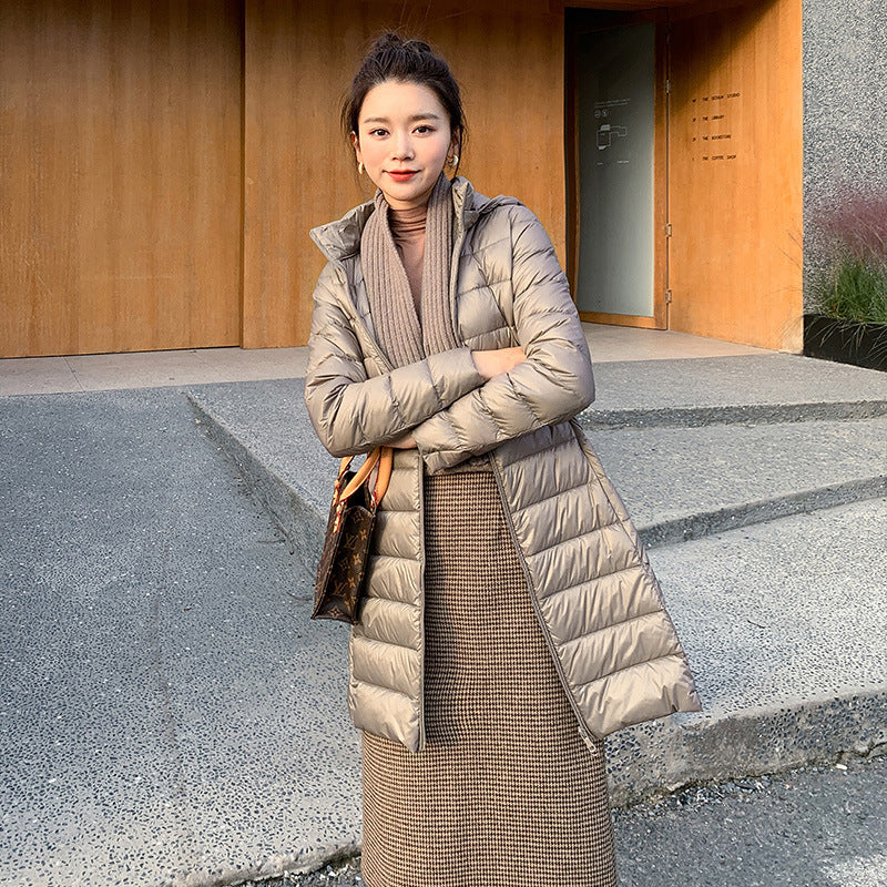 A mid-length, lightweight down jacket for women