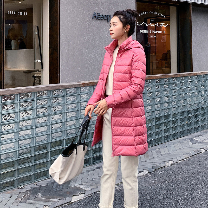 A mid-length, lightweight down jacket for women